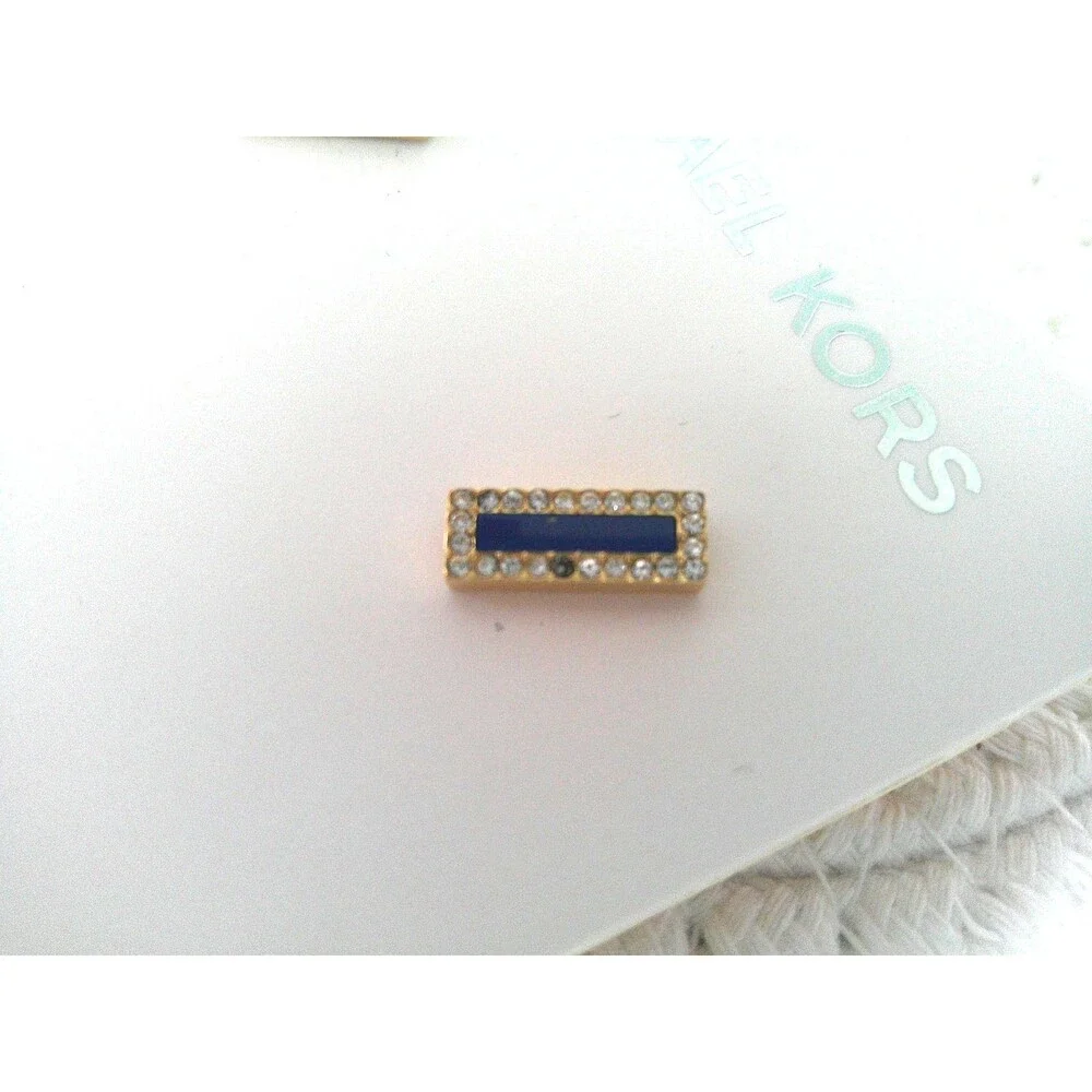 Michael Kors Sapphire and Diamond Earrings. One tiny stone missing. Retailed $85